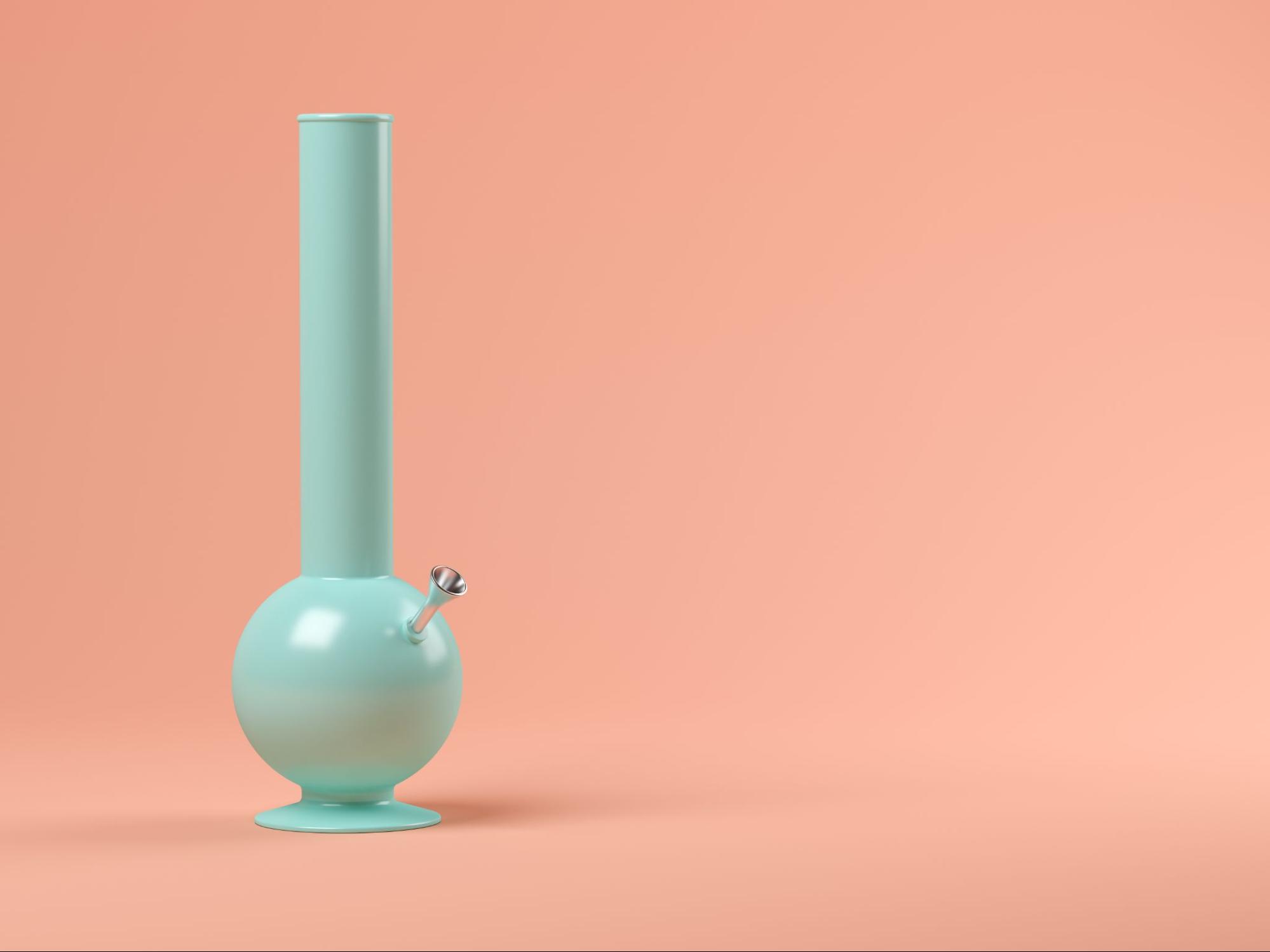 A bong with a blank peach background. 