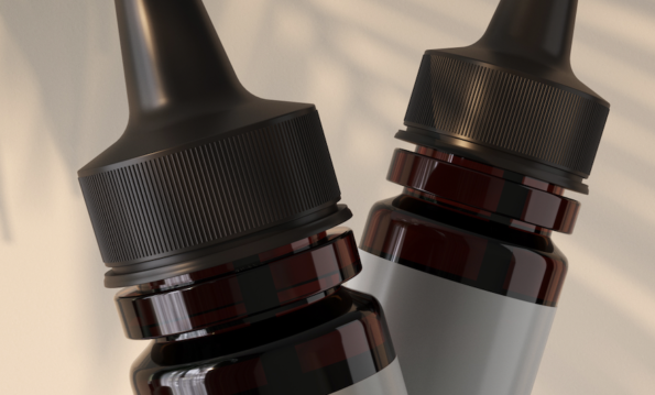 Two amber glass bottles containing nicotine salts, complete with droppers, set on a beige background adorned with tropical leaf shadows.