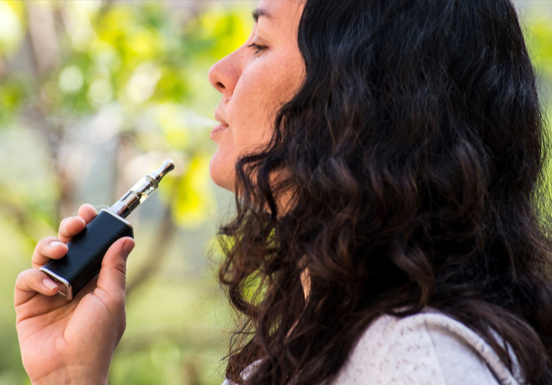 Woman using a vape.