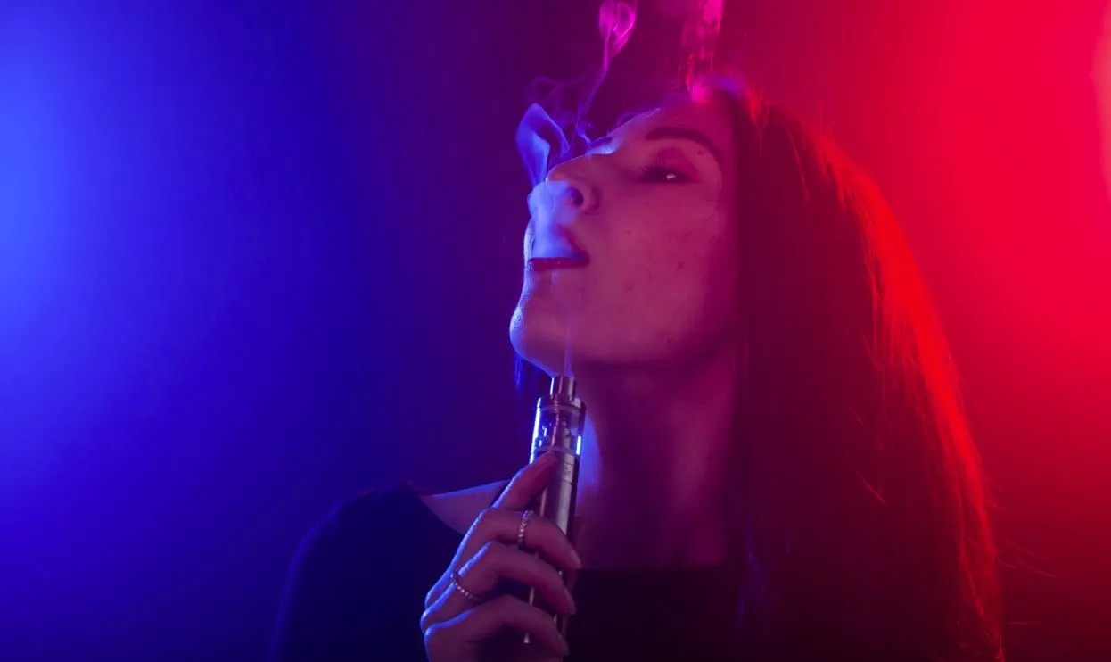 a woman vaping