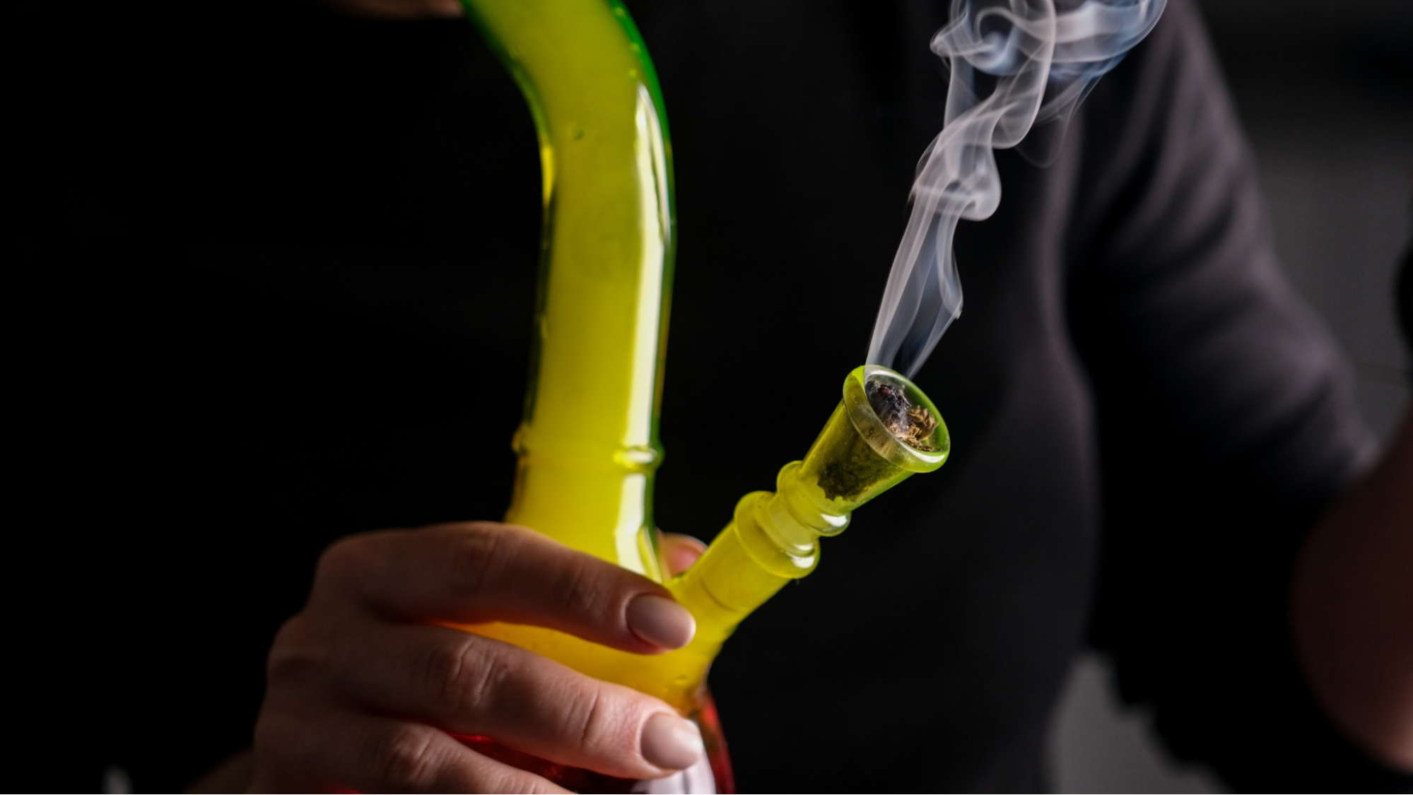 Someone smoking from a bong Someone smoking from a bong